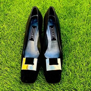 Black square heel with buckle design and design on heel.